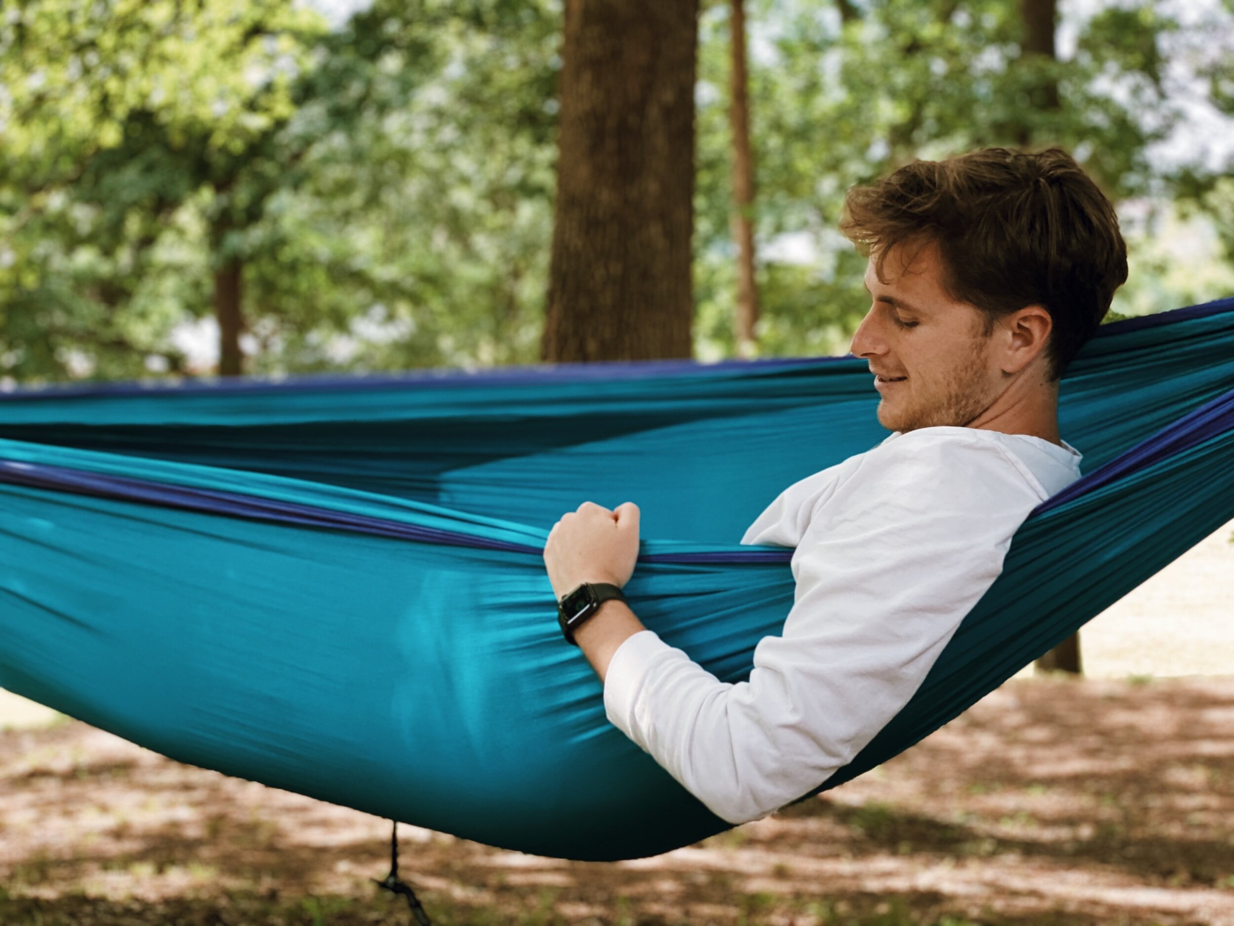 man resting in a hammock